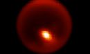 Adaptive optics image of Titan showing storm feature.