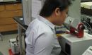 student in front of a microscope