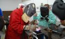 Two students learning welding skills at Weld-Ed.
