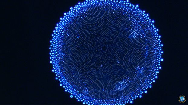 Image of a microscopic image of water droplet residue. The Image looks like a blue sunflower.