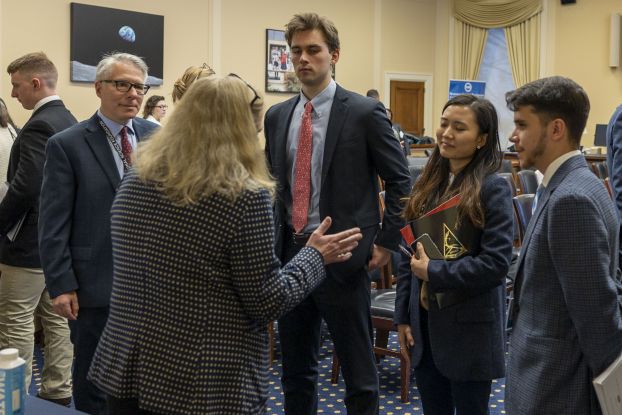 people conversing in meeting room