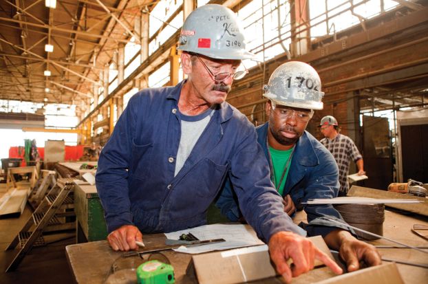 Two workers wearing hard hats