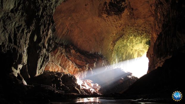 Sun streams into the entrance of Deer Cave