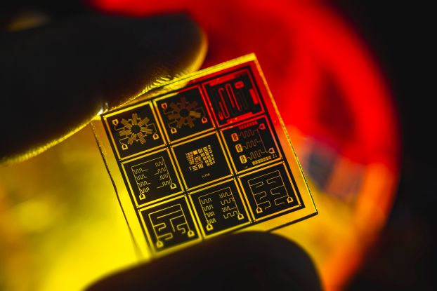 a yellow and orange close-up view of a quantum chip