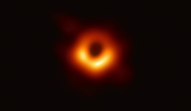 A glowing orange ring of light against a black background.