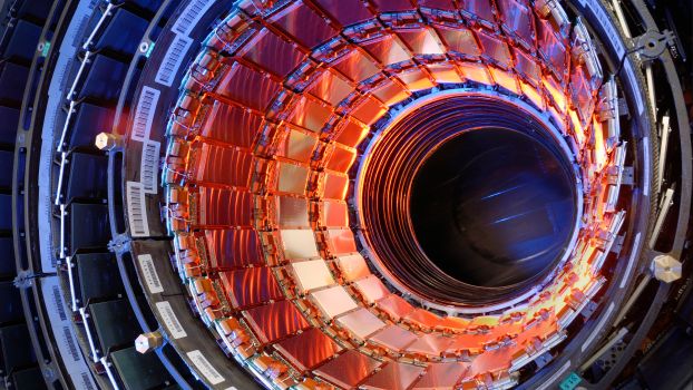 View of large circular instrument with various sensors and panels arranged around a center lens-like compartment.