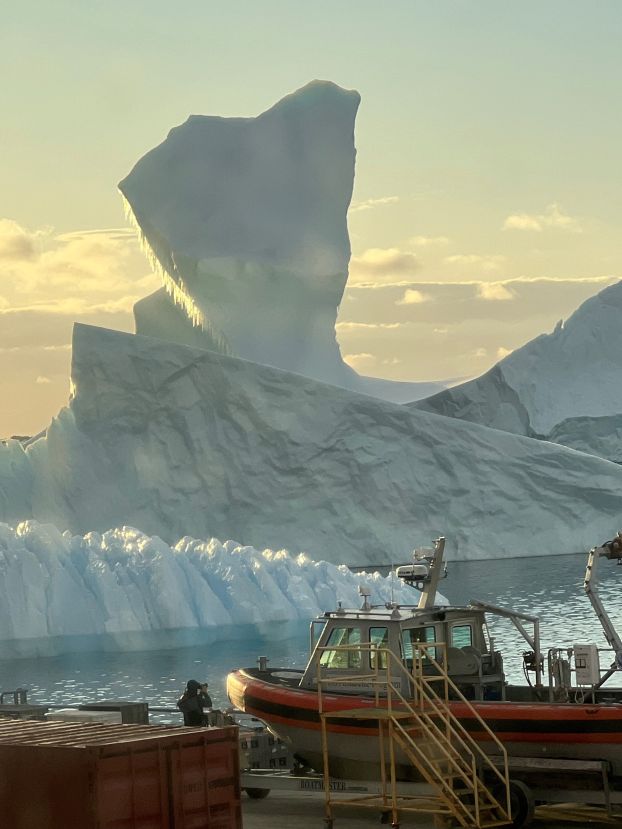 profile image against the sky of a large, irregularly-shaped iceberg