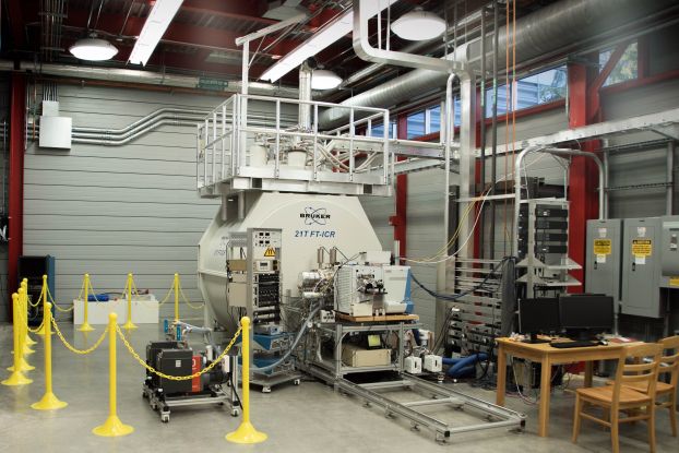 A large experimental setup surrounded by a safety cordon.