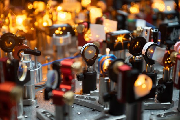 The picture shows the Will lab for the creation of Bose-Einstein condensates of dipolar sodium-cesium (NaCs) molecules. The optical benches show laser systems for laser cooling and the vacuum system in which the molecules are cooled to nanokelvin temperatures.