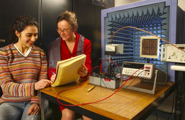 A professor explaining a procedure to a student