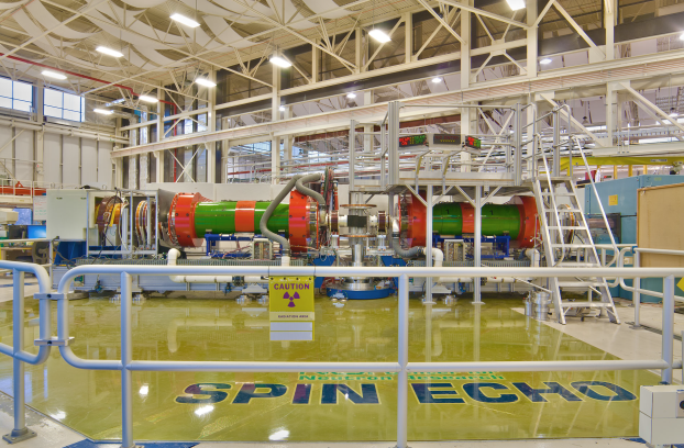 A complex apparatus inside a large, cavernous laboratory.