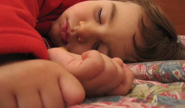 child sleeping on their side