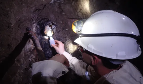 scientist working within a cavern 