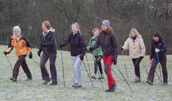 women walking with walking sticks