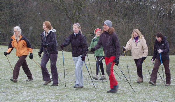 women walking with walking sticks