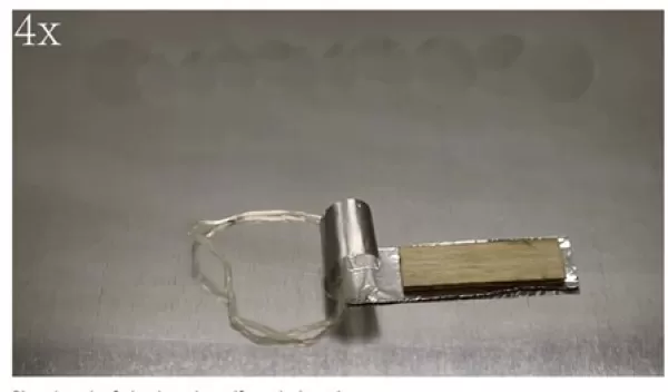 A ringbot tows a payload across a flat surface.