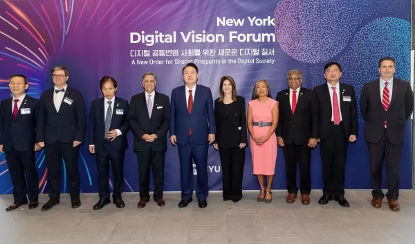 A group photo at NYU includes NSF Director Sethuraman Panchanathan, ROK President Yoon Suk Yeol, NYC Deputy Mayor Sheena Wright, and others.
