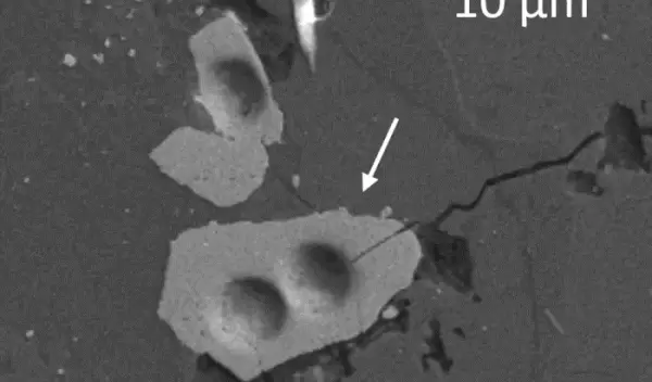 A lunar zircon grain under a microscope.