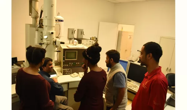Explaining transmission electron microscopy to students.