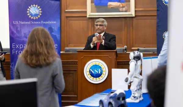 man speaking at podium