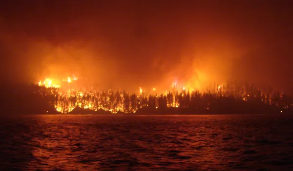 a wildfire as seen across Loon Lake, British Columbia