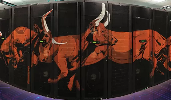 a group of high tech computers with printed red bulls running wrapped on the front of the computers