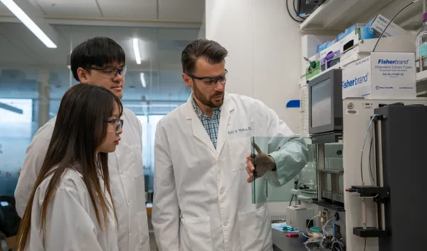 research team in a white lab coat
