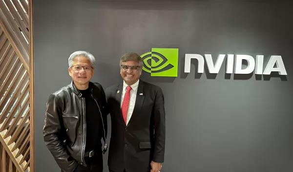 two men standing in front of wall with logo NVIDIA