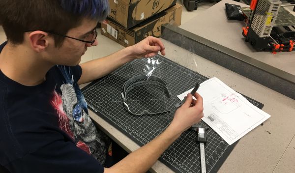 college student assembles 3D printed face shield