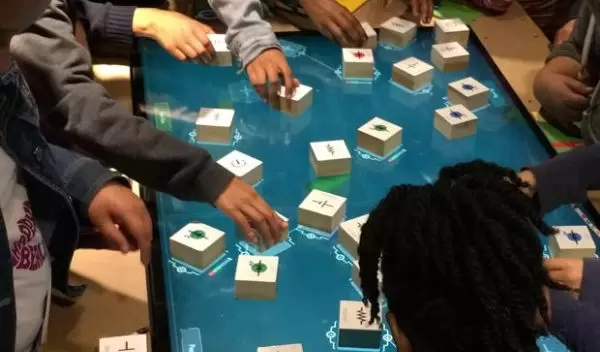 children assembling test circuits