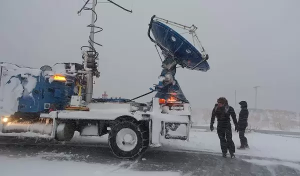 DOW scientists Karen Kosiba and Traeger Meyer with radar truck