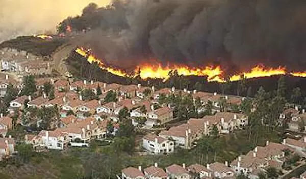 Approaching wildfire threatens a subdivision