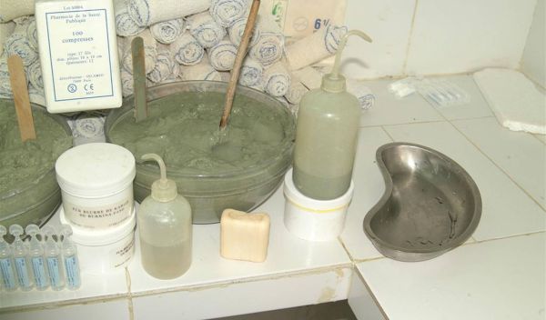 French green clays in pots, bottles and soap on a counter