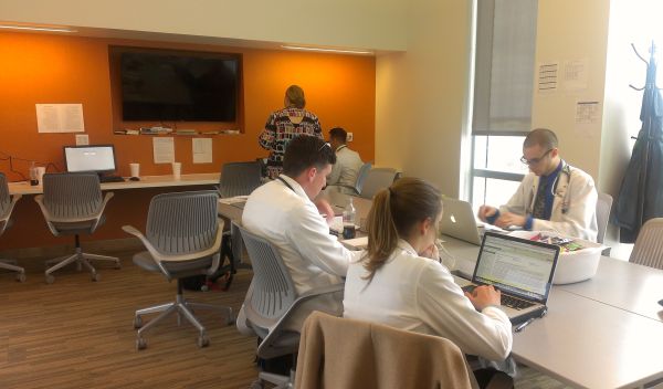 doctors working on laptops