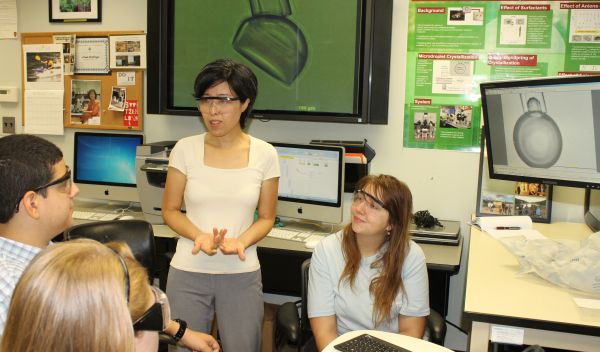 Sunghee Lee and three students in her lab