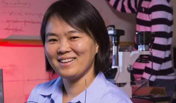 Linxia Gu with a stent catheter and a doctoral student