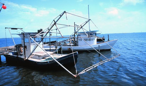 two shrimp boats in the ocean