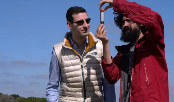 Researchers examine sample from marsh