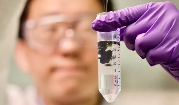 Engineer Xiaofei Zhao prepares a solution