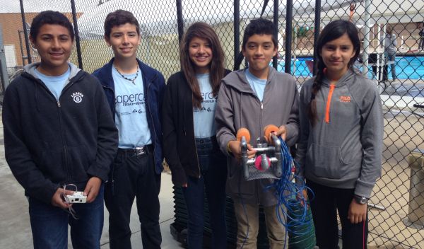 Children in a Sea Perch team with a remotely operated vehicle.