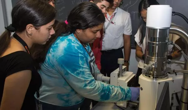 Professor Nicholas Pinto at UPR-Humacao teaching high school students how to use a scanning electron microscope.