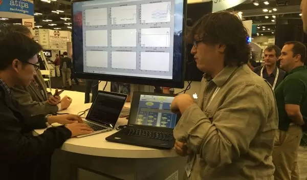 people with computers at a conference