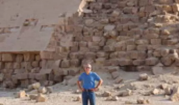 Photo of a man in front of one of the pyramids