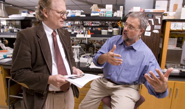Photo of Jonathan Arnold and Heinz-Bernd Schuttler discussing their work on biological clocks.