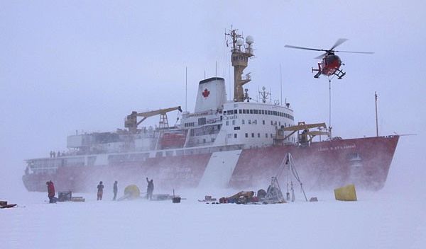 crew members deploy equipment onto the ice from a Canadian icebreaker