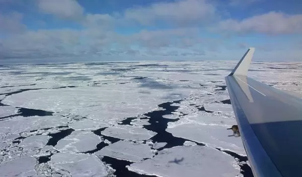 The NSF/NCAR Gulfstream V casts a shadow on the marginal ice zone of the Southern Ocean.