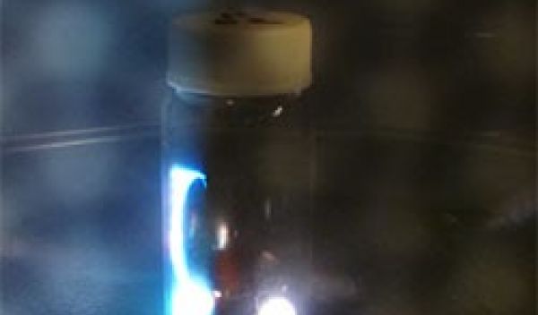 in a microwave oven, sparks are generated inside a glass vial