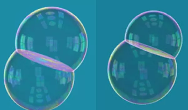Side-by-side images of double-bubbles of equal and unequal volume chambers.