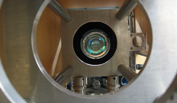 Photo of end-on view of high numerical aperture custom lens system used to trap and image an atom.