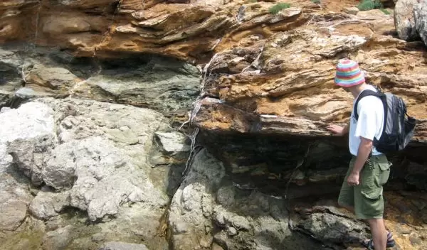 Photo of Cristiano Collettini looking at the Zuccale Fault on the Isle of Elba, Italy.